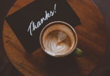 일상 속 스트레스를 완화하는 작은 변화 flat lay photography of coffee latte in teacup on table