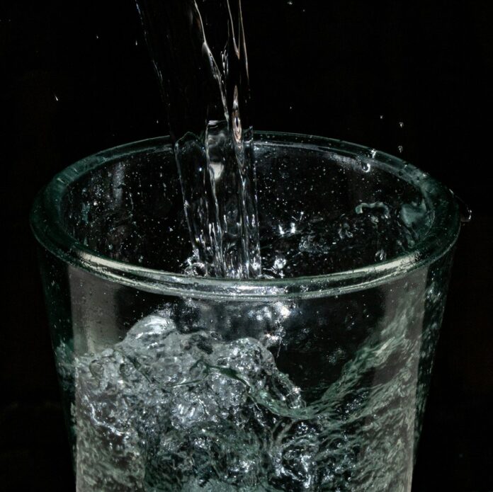 Photo by Ian Talmacs a glass of water