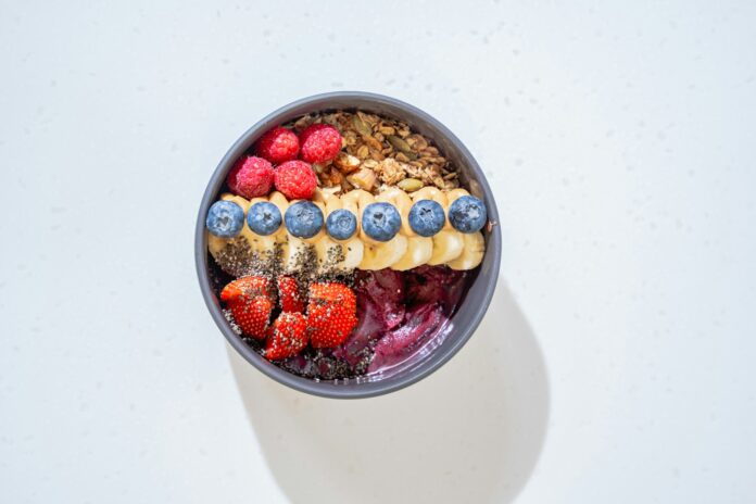 Photo by Eiliv Aceron a bowl of cereal with milk and fruit