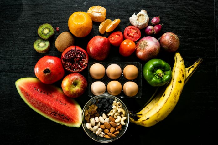 Photo by sundaraprakash r yellow banana red apple and yellow banana fruit