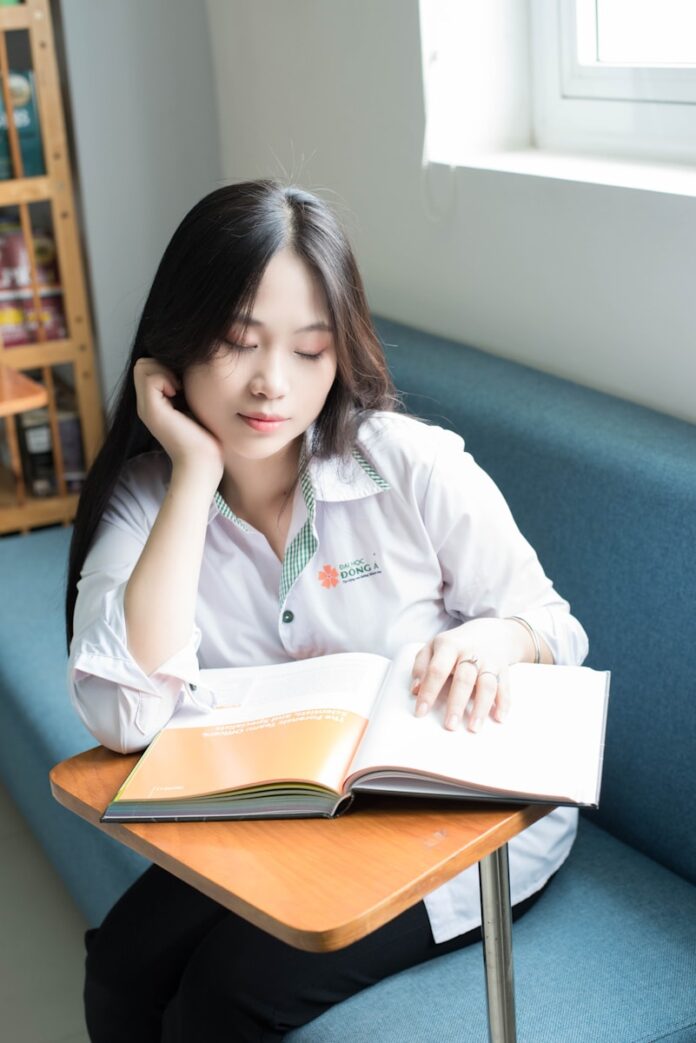 Photo by Keisha Kim a woman reading a book