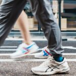 바쁜 일상 속 ‘걷기 운동’으로 건강 챙기기…실천 노하우 주목 People walk on a crosswalk, showing only their legs